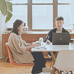 Weekly Quiz; Image: couple at a table doing work