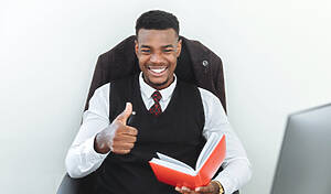 Federal Benefits - professional man reading a red book
