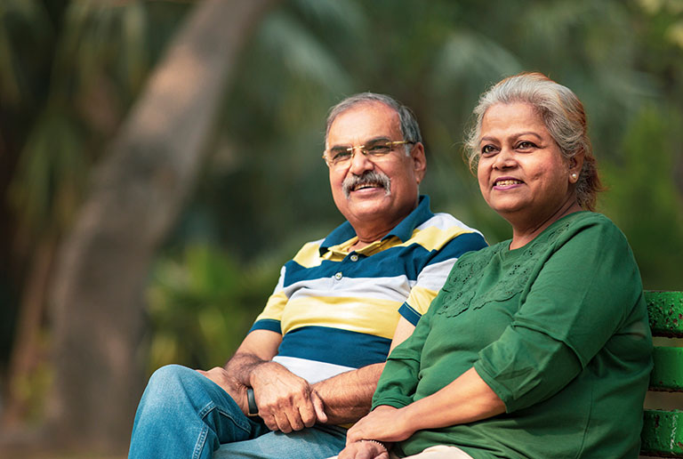 Happy Old Couple On Bench