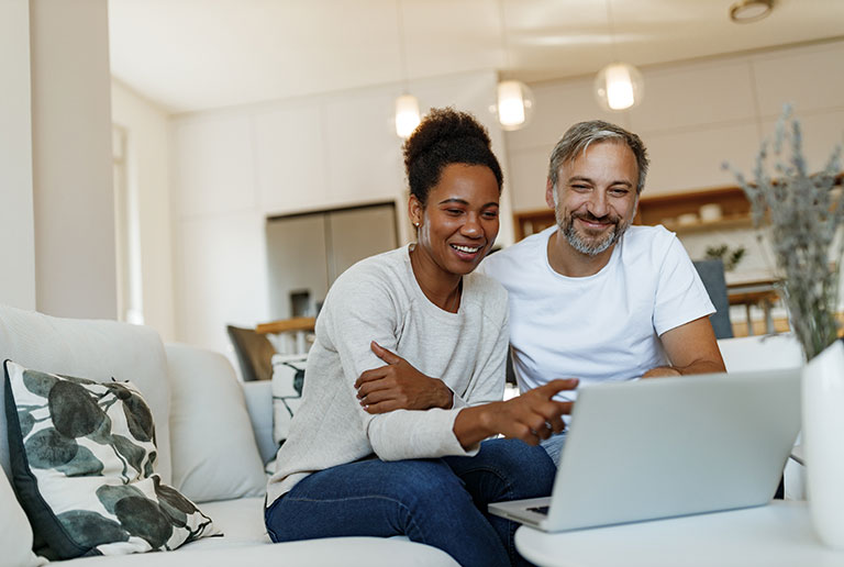 Couple Using Laptop
