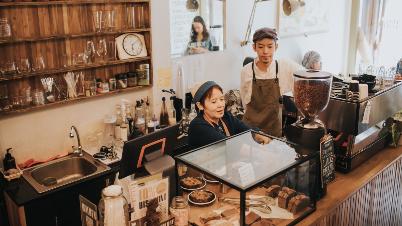two people working in a coffee shop